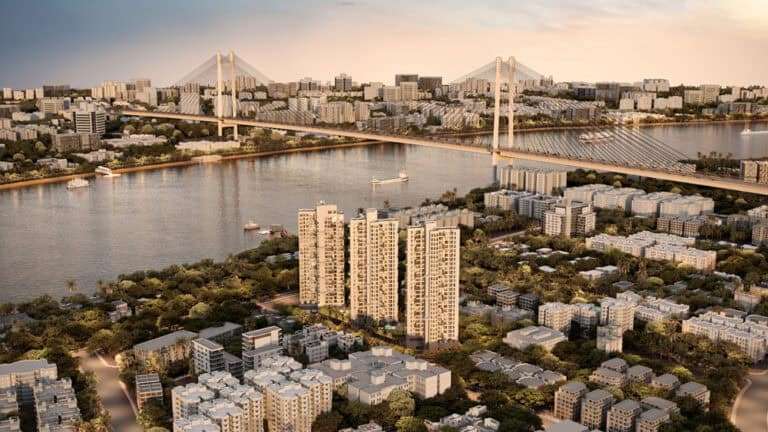 Stunning view of luxury flats in Howrah overlooking the Ganga River and iconic bridge.
